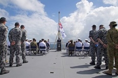 Minister Miyashita giving a speech on board HMAS Choules
