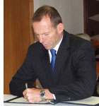 Tony Abbott signs condolences book
